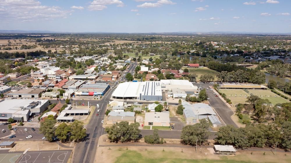 An Aerial View of A Small Town with Lots of Buildings and Trees — Cool Blue Ice & Water in Forbes, NSW