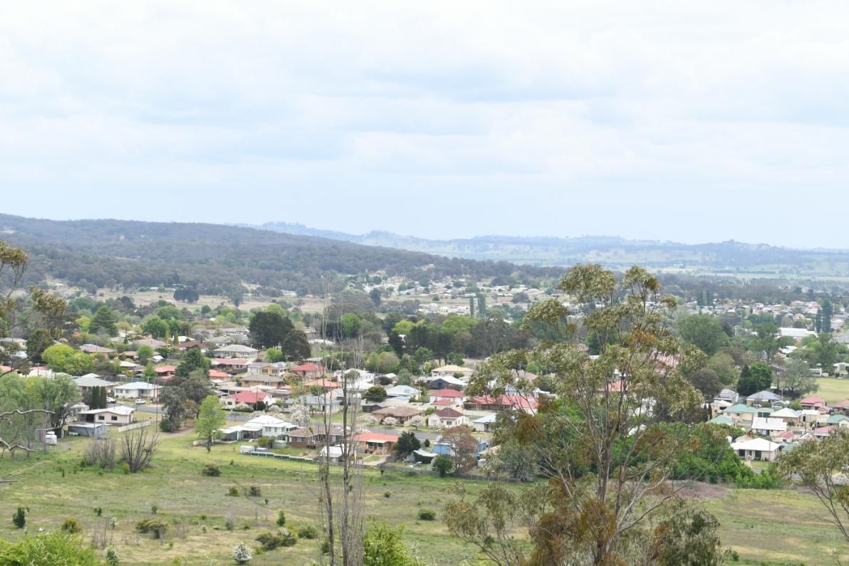 A View of A Small Town from A Hill with Mountains in The Background — Cool Blue Ice & Water in Glen Innes, NSW