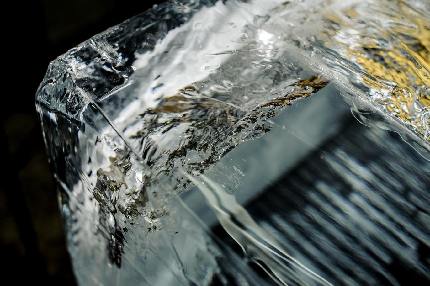 A Close up Of a Piece of Ice on A Black Background — Cool Blue Ice & Water in Merriwa, NSW
