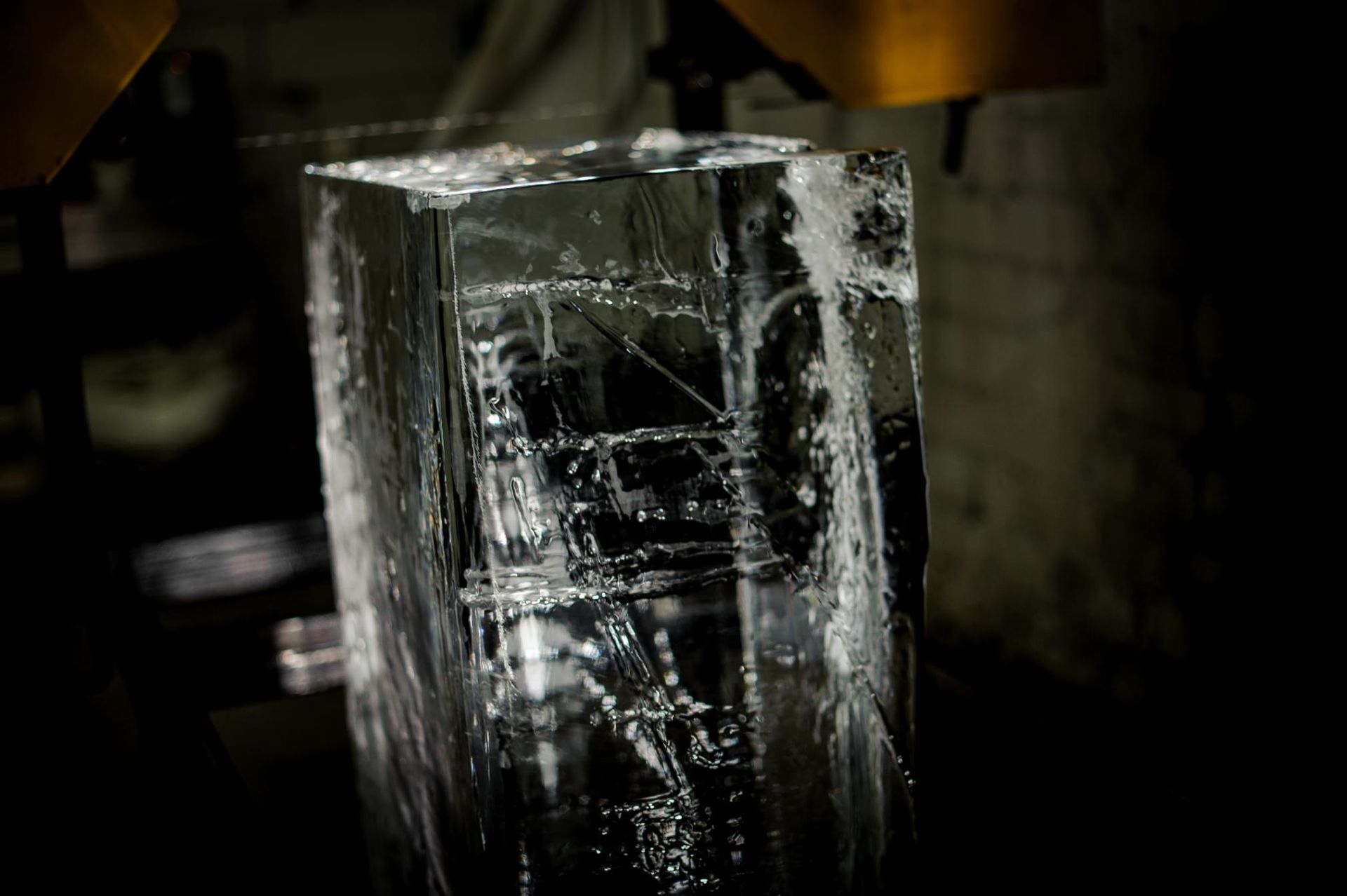 A Large Piece of Ice Is Being Cut with A Machine — Cool Blue Ice & Water in Armidale, NSW