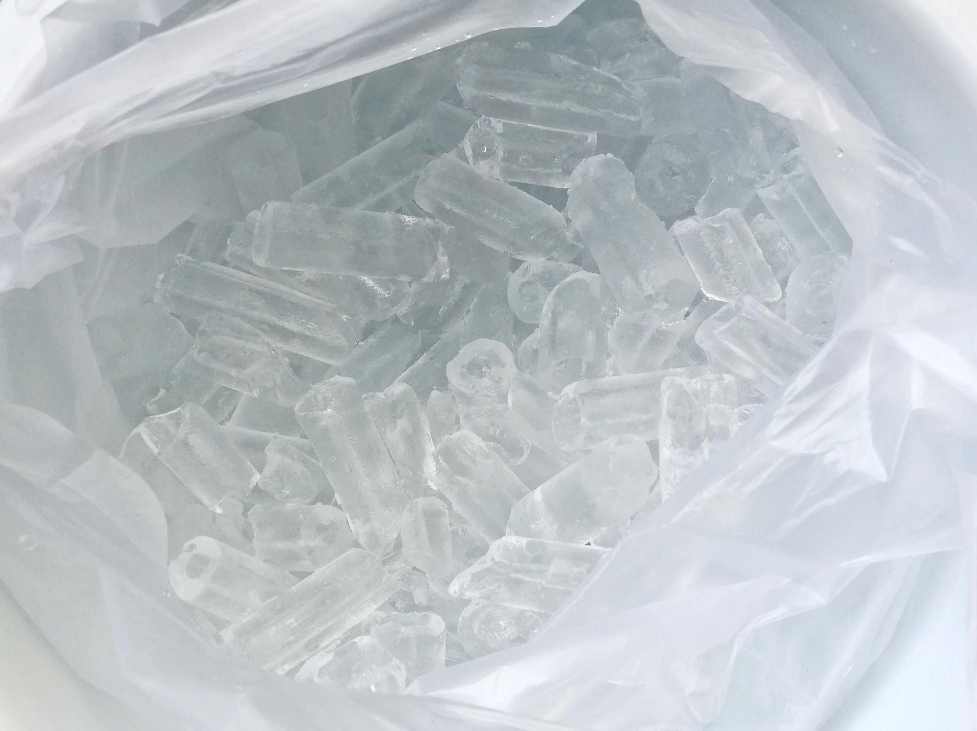 A Bag Filled with Ice Cubes Is Sitting on A Table — Cool Blue Ice & Water in Walgett, NSW