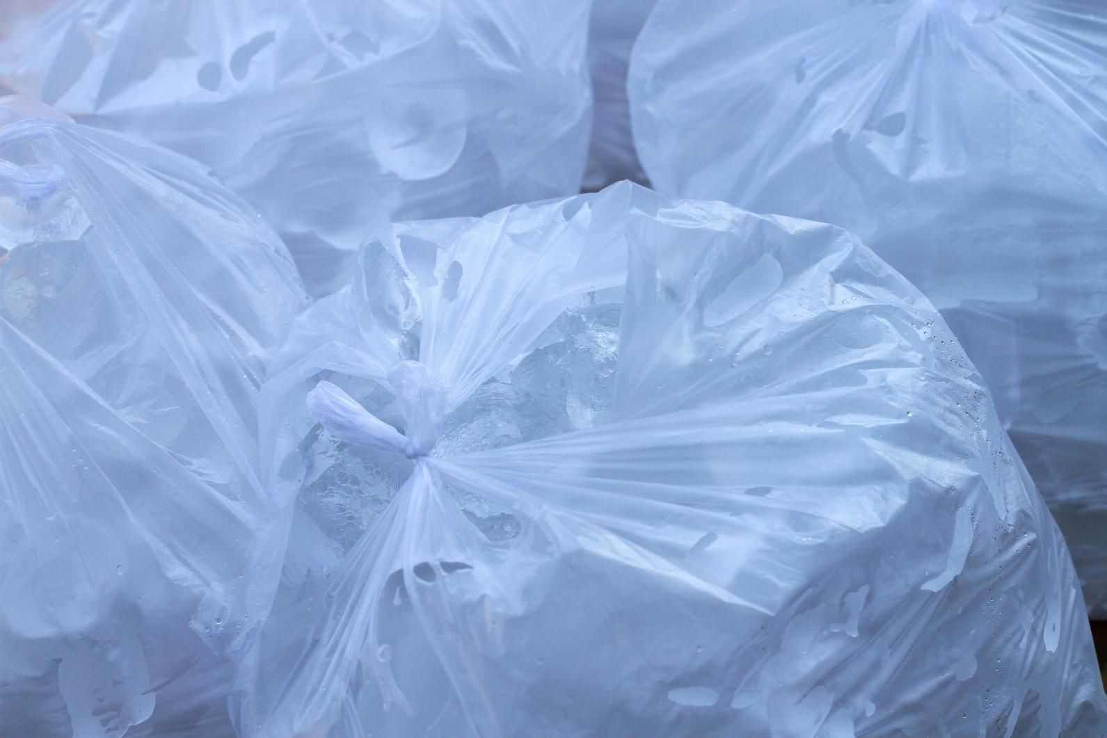 A Pile of Plastic Bags Filled with Ice Cubes — Cool Blue Ice & Water in Muswellbrook, NSW