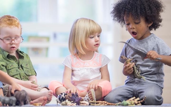 children playing animal and dinosaur toys
