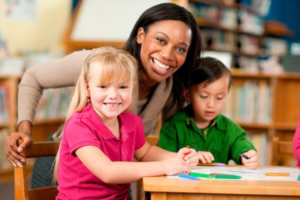 teacher and children in daycare