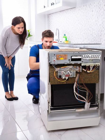 technician during oven repair service