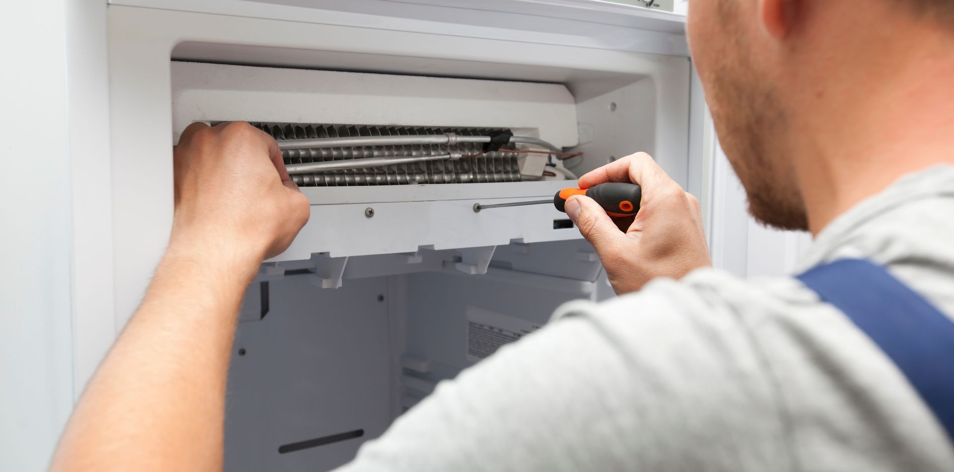 technician performing appliance repair services