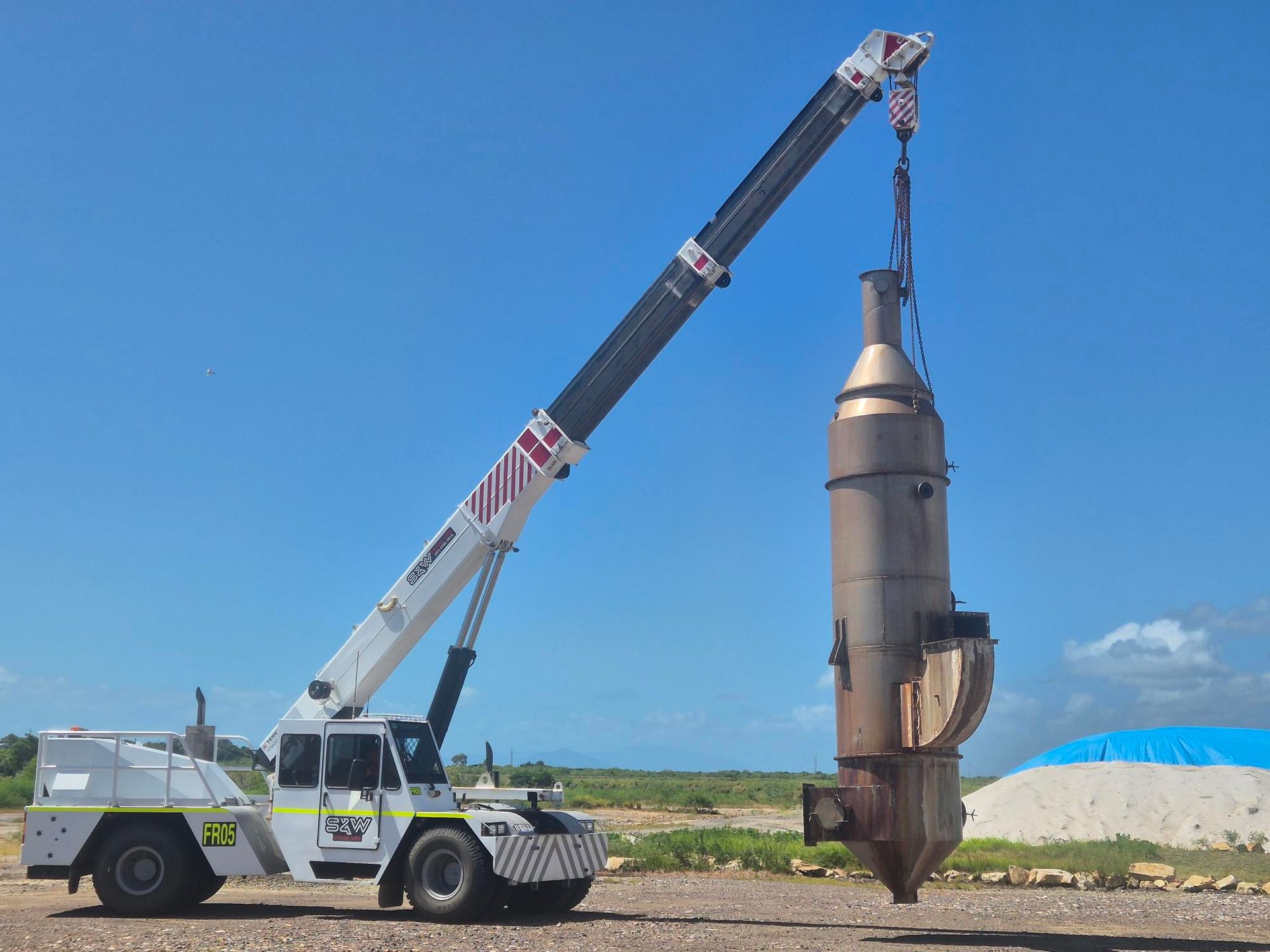 Crane Lifting a Large Metal Structure on a Construction Site — Kaplan Engineering Pty Ltd In Bowen, QLD