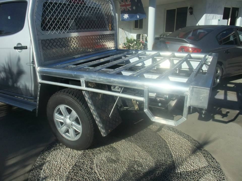 A Silver Truck With A Metal Tray On The Back Is Parked In A Driveway —Kaplan Engineering Pty Ltd In Bowen, QLD
