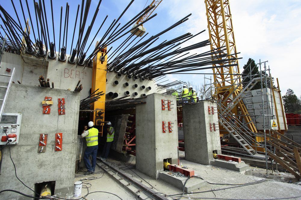 A Construction Workers Working On A Bridge Under Construction — Kaplan Engineering Pty Ltd In Bowen, QLD