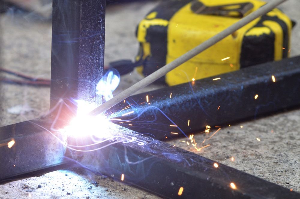 A Close Up Of A Person Welding A Piece Of Metal — Kaplan Engineering Pty Ltd In Collinsville, QLD