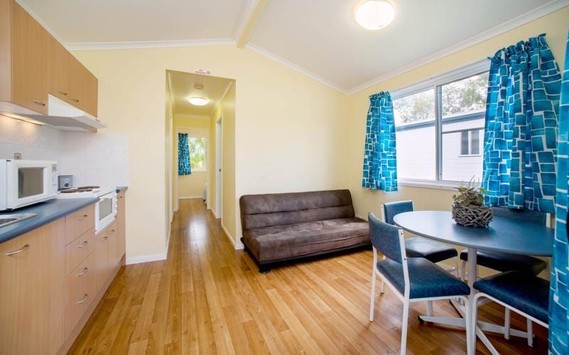 Fully Furnished Cabin Livingroom — Caravan Park in Woombah, NSW
