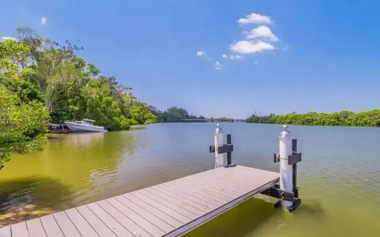 River with Jetty — Caravan Park in Woombah, NSW