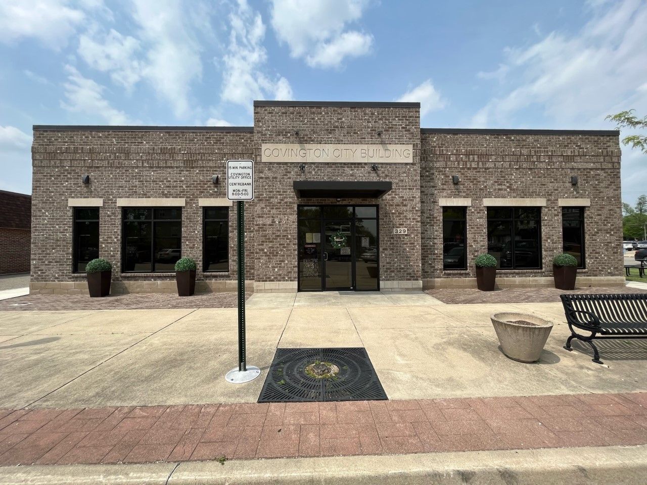 A brick building with a no parking sign in front of it
