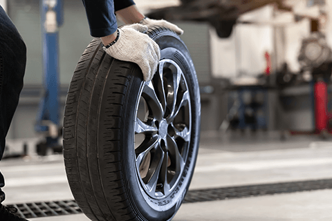 Holding Black Tire — Monroe, NC — Small Bros. Tire Co Inc.