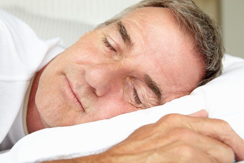 Close up of mature man's face as he sleeps