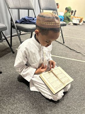 child reading quran