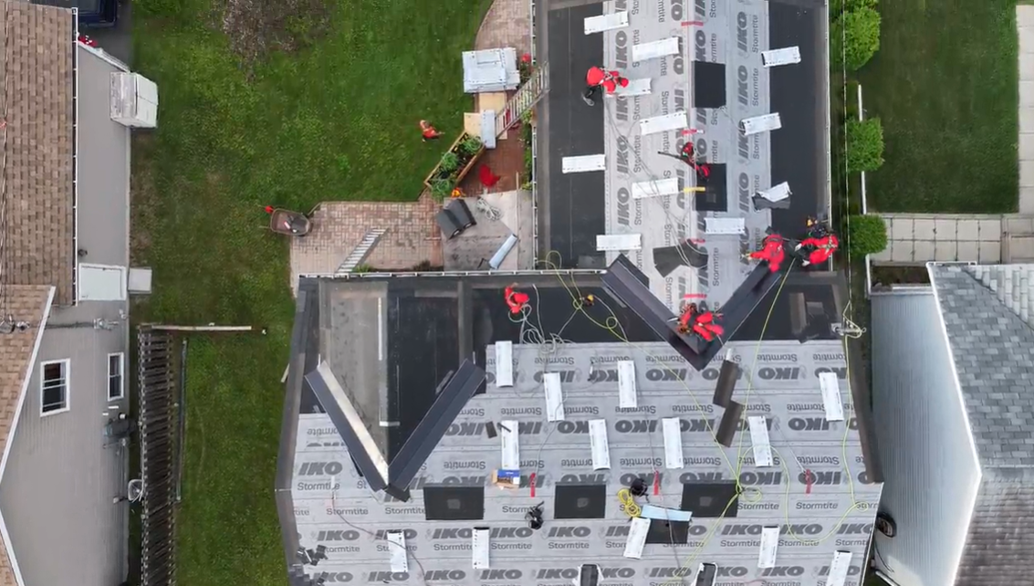 Close-up view of brown asphalt shingle roof.