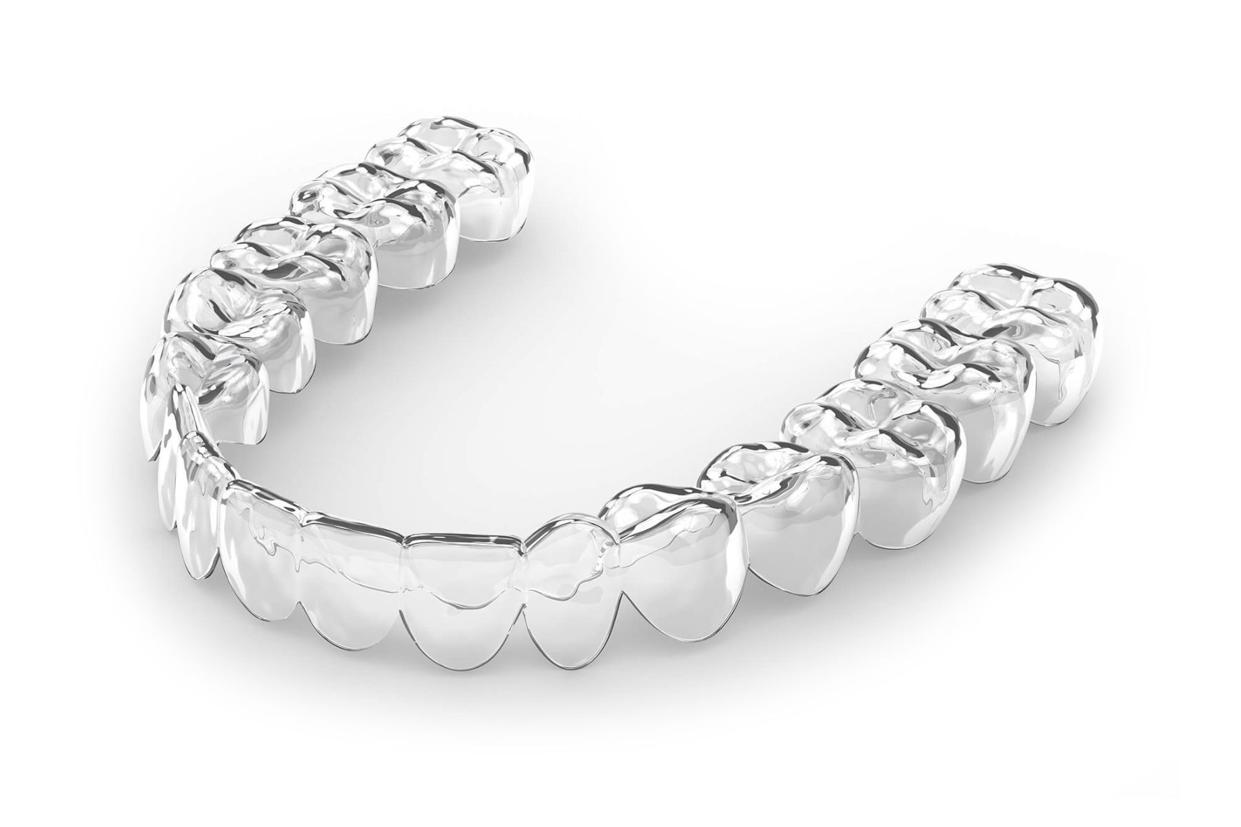 Clear aligner for teeth, showing a molded, transparent plastic tray.