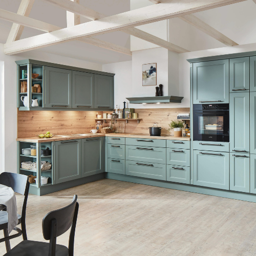 Spacious, two-tone kitchen with teal cabinets, wood accents, and exposed ceiling beams.