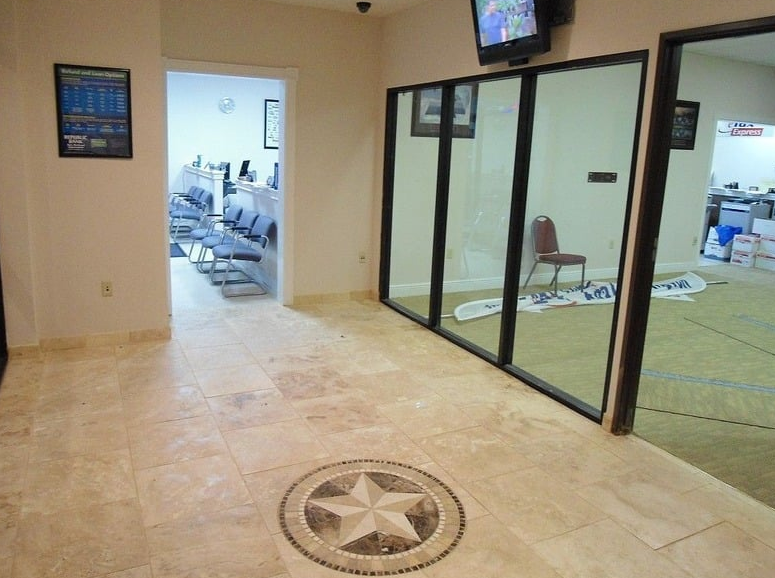 A waiting room with a texas star in the middle