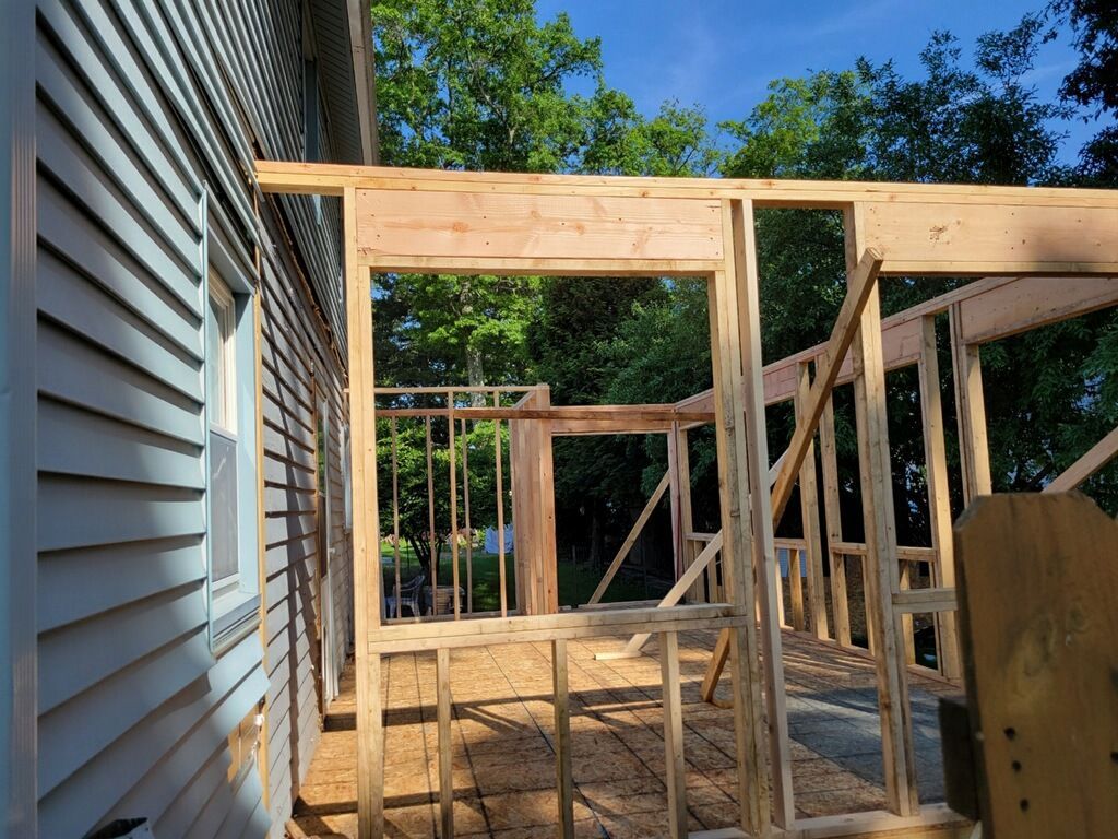 A house is being built with wooden frames.