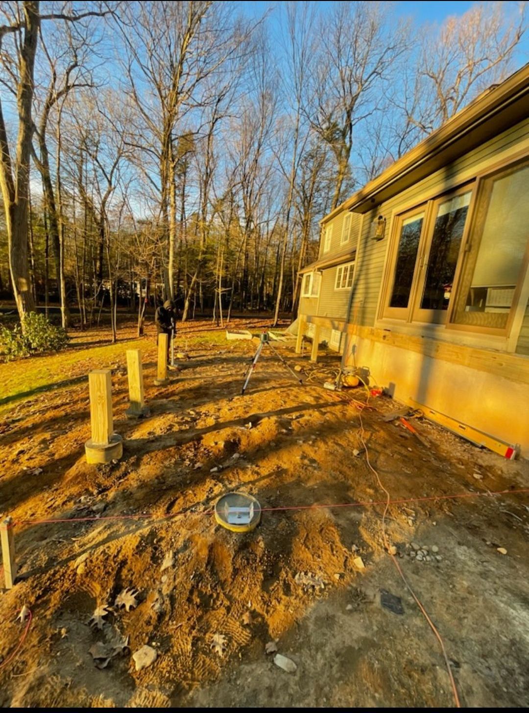 A house is being built in the middle of a forest.