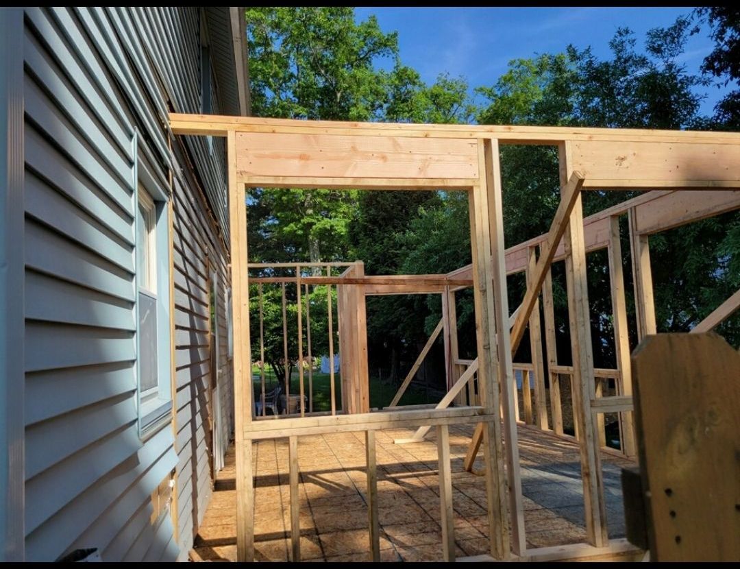 A house that is being built with a lot of wood