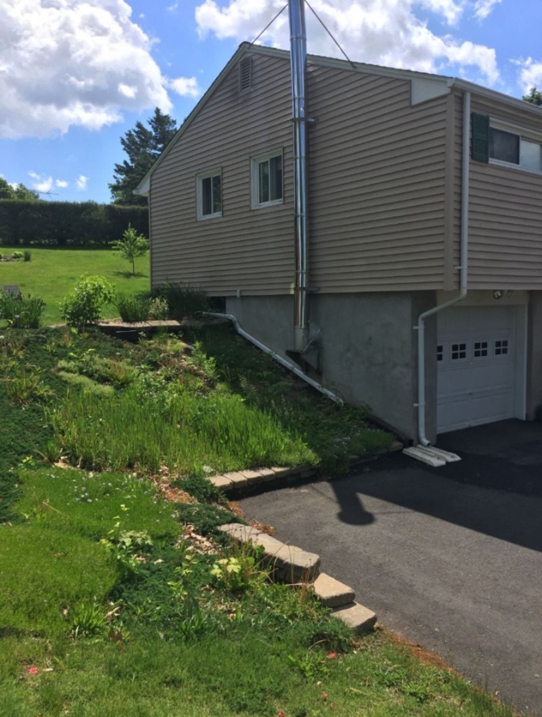 A house with a chimney on the side of it