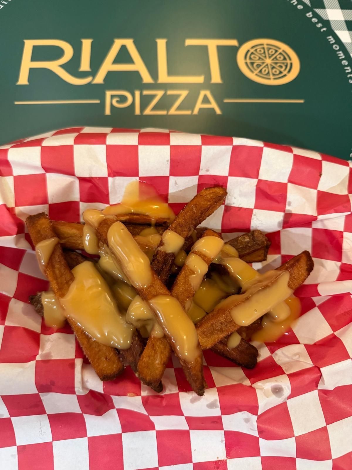 Rialto Pizza lunch special: Chicken wings, fries, and soda for $13.99, Monday 11 AM-3 PM.