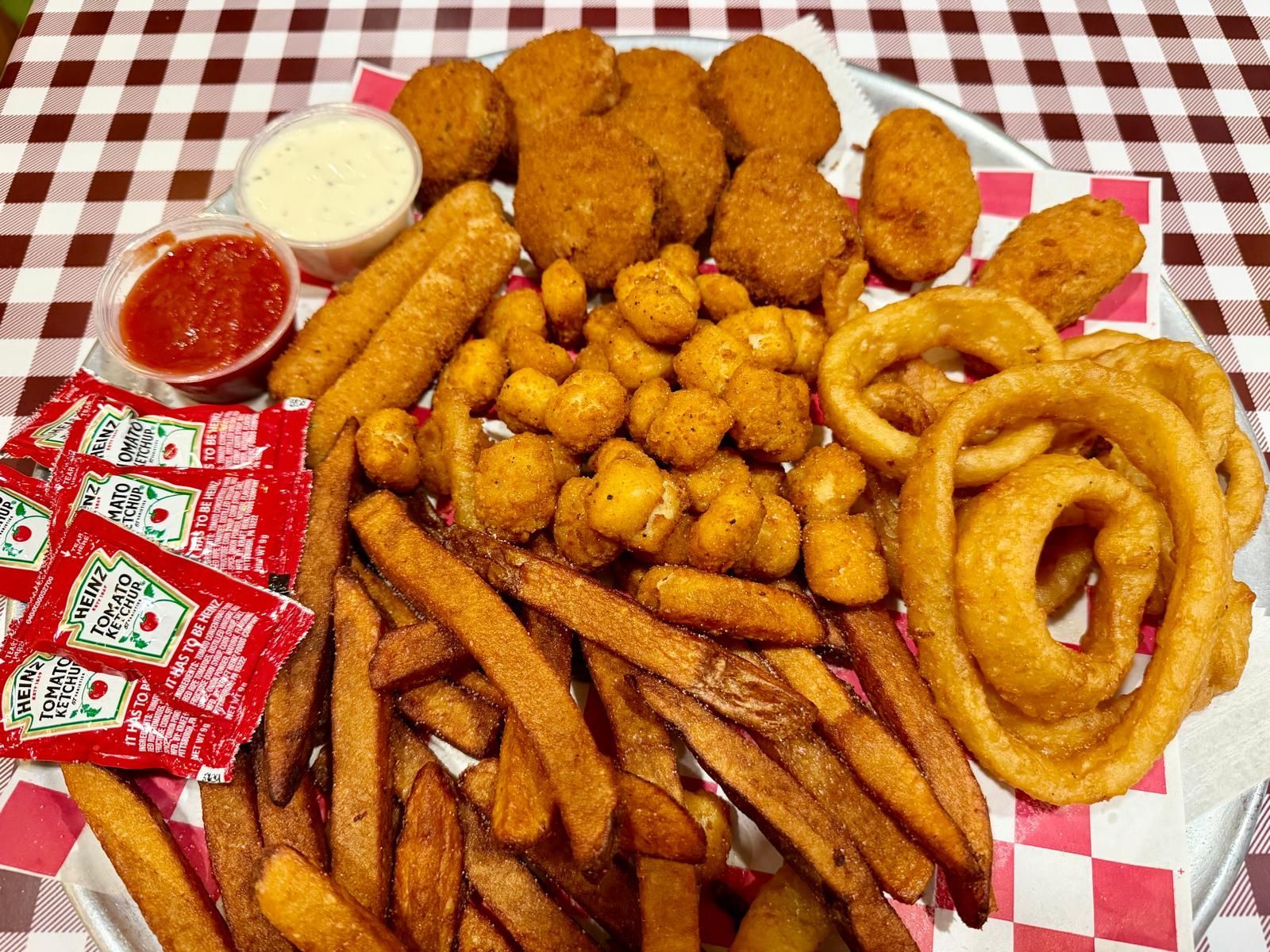 Rialto Pizza lunch special: Chicken wings, fries, and soda for $13.99, Monday 11 AM-3 PM.