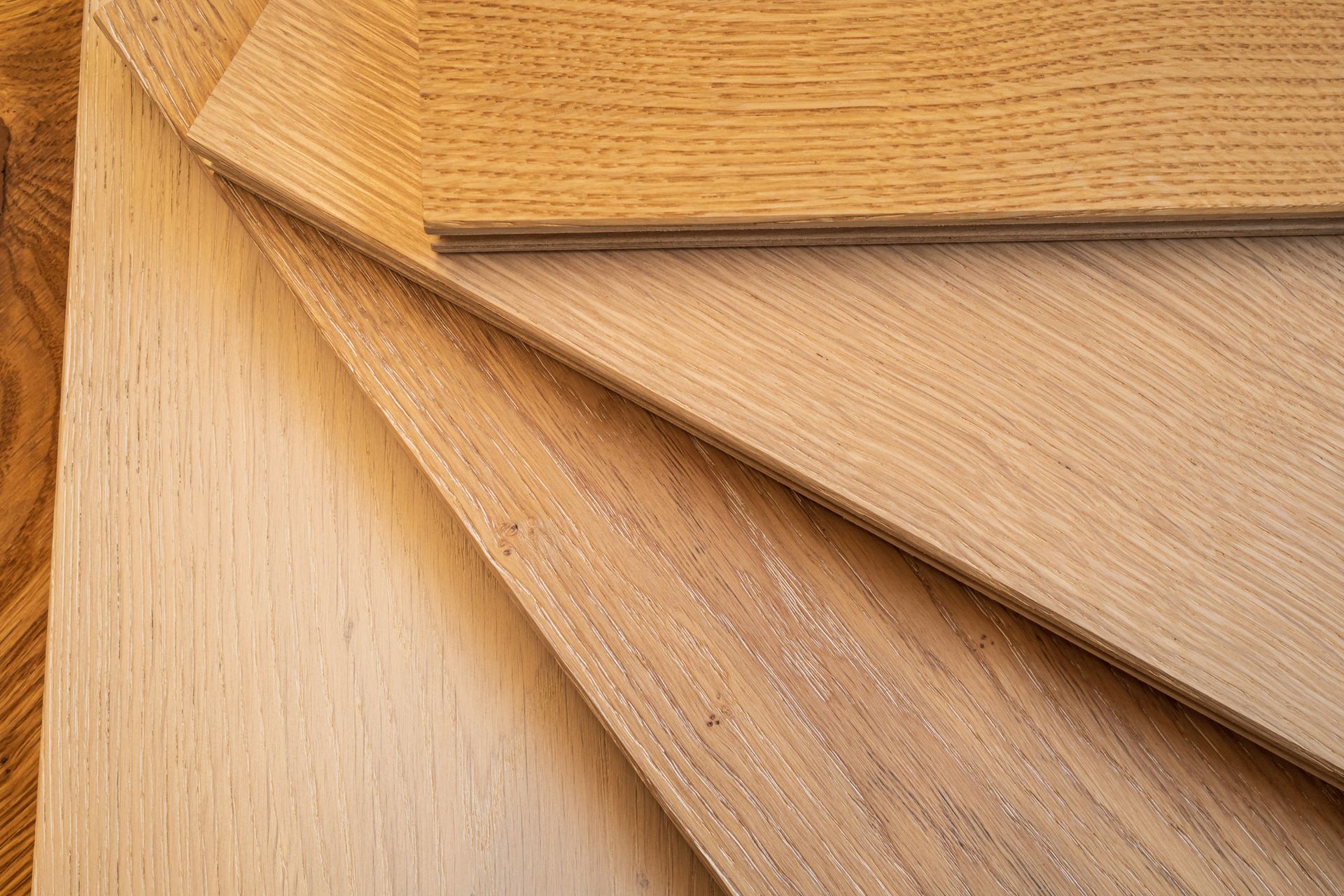 Top view, selective focus of light Engineered hardwood or laminate flooring samples