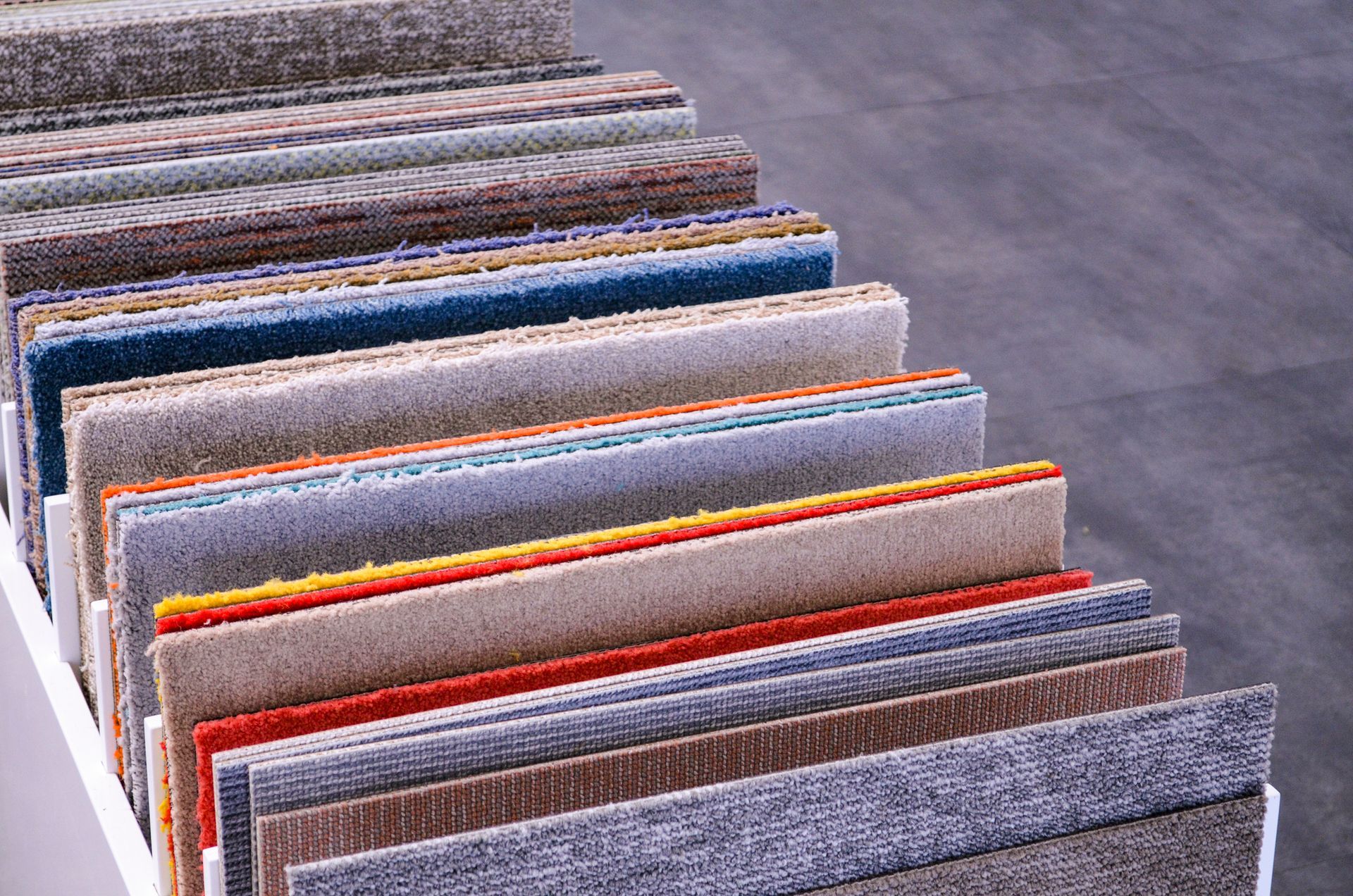 Carpet fabric swatch in a showroom.