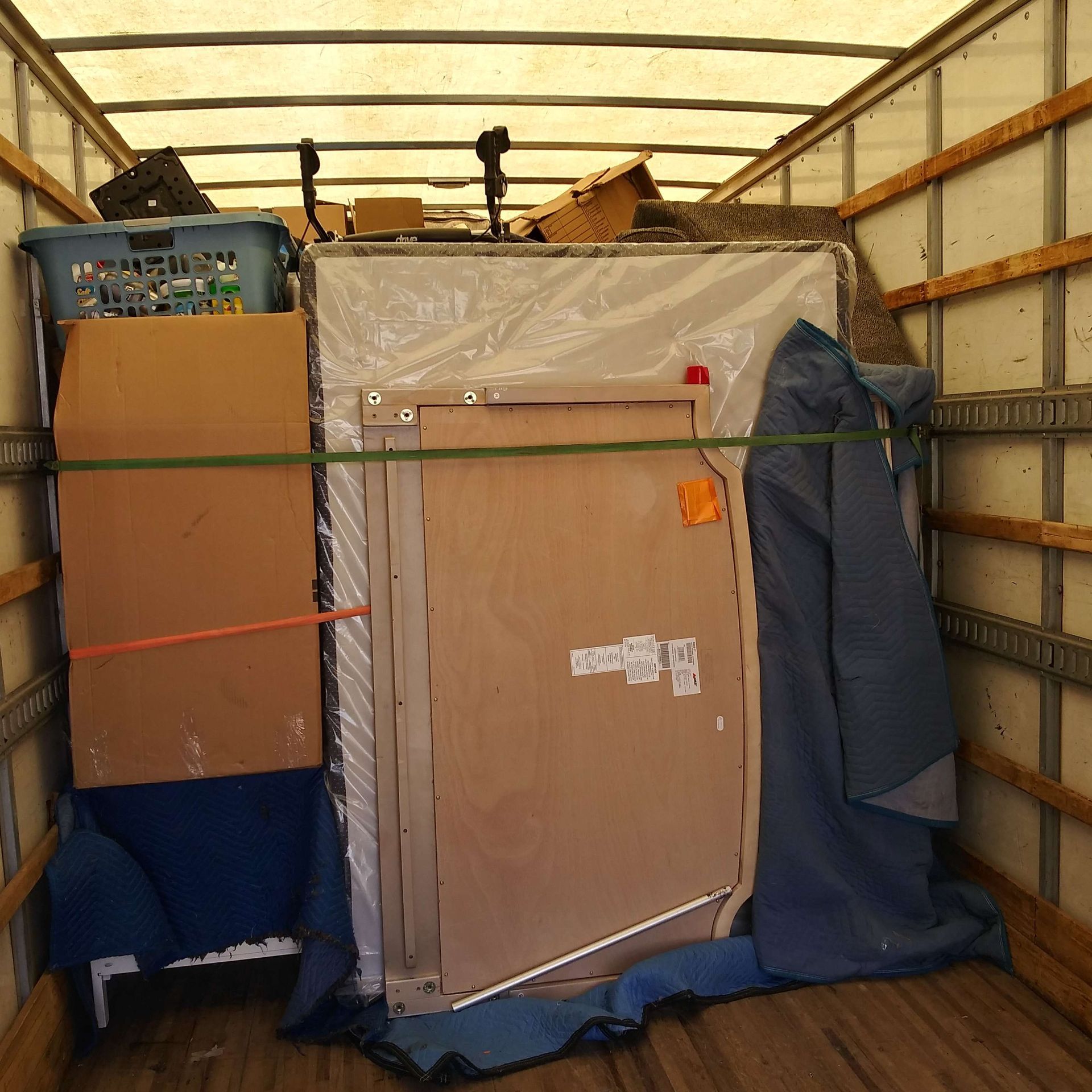 A moving truck filled with boxes and a picture