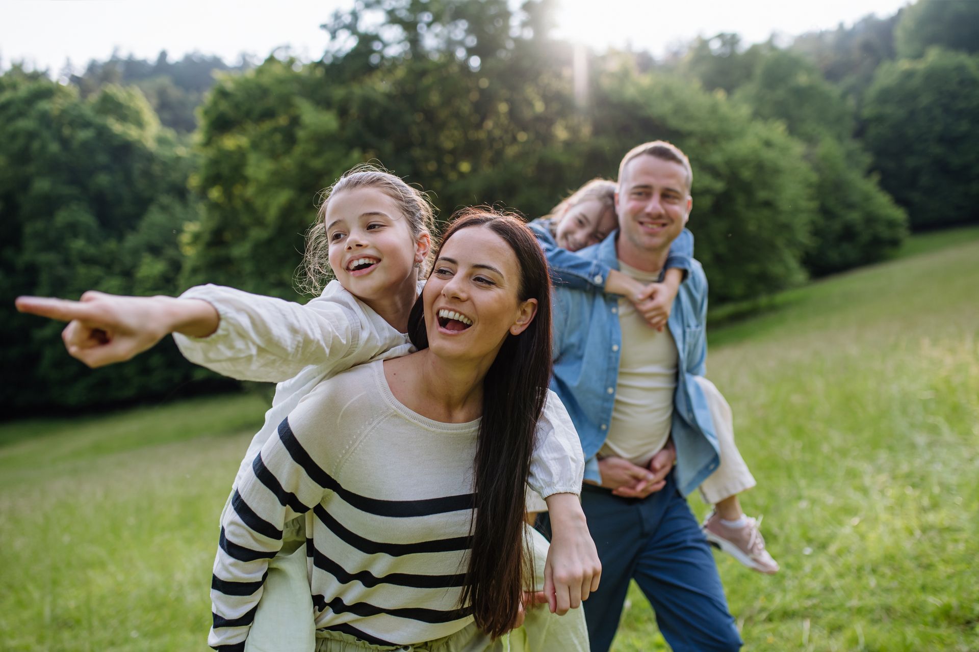 A group of people are posing for a picture together and smiling.