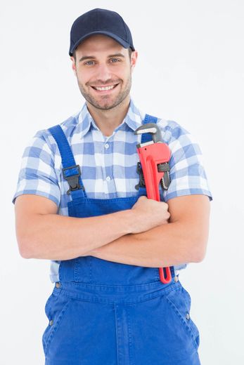 Plumber  — Confident Young Male Repairman Holding Adjustable Spanner in Boise, ID