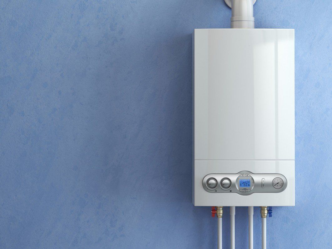 Water Heater Repair — Electric Boiler, Water Heater On The Blue Wall in Boise, ID