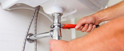 Plumber — Man Fixing Faucet Pipe in Boise, ID