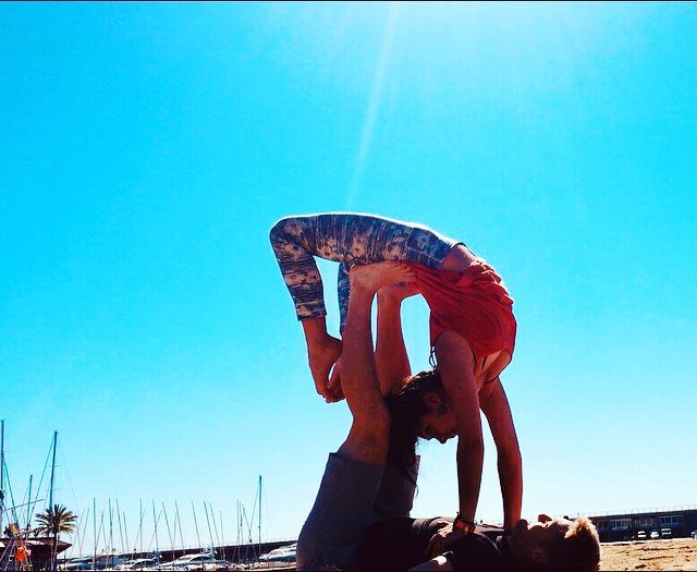 Xander Clemens with Emily Worsnop in Barcelona practicing yoga.