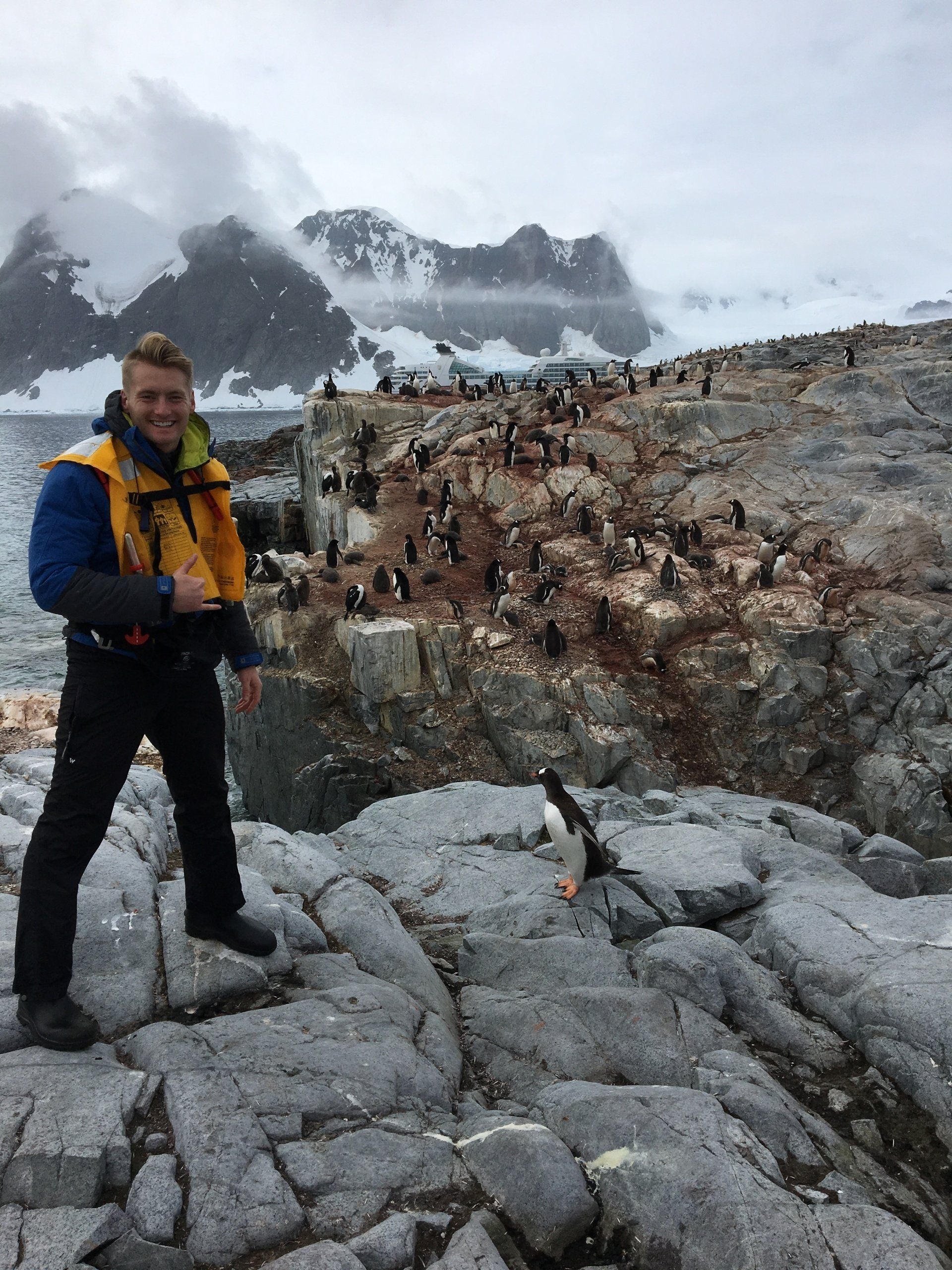 Alexander Clemens in Antartica with penguins.
