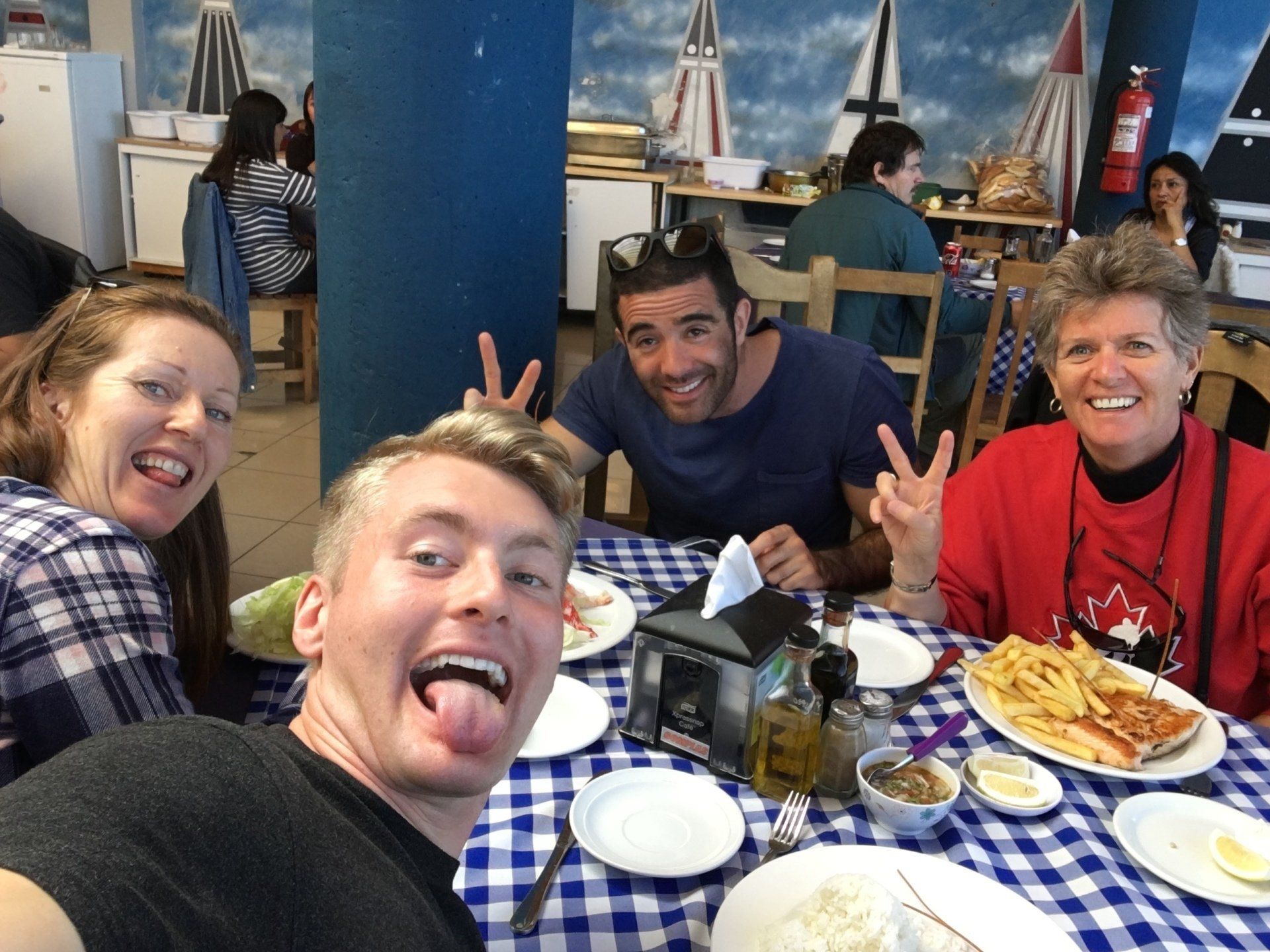 Xander Clemens in Castro, Chile with crew members of the Seabourn Quest and a guest.