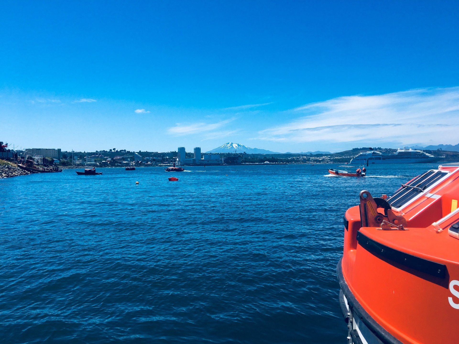 View of the Seabourn Quest with a mountain in the background in Chile.