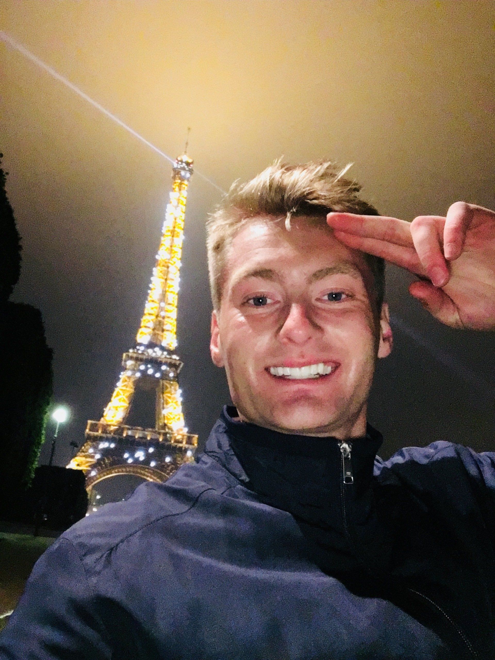 Xander Clemens in front of the Eiffel Tower in Paris, France