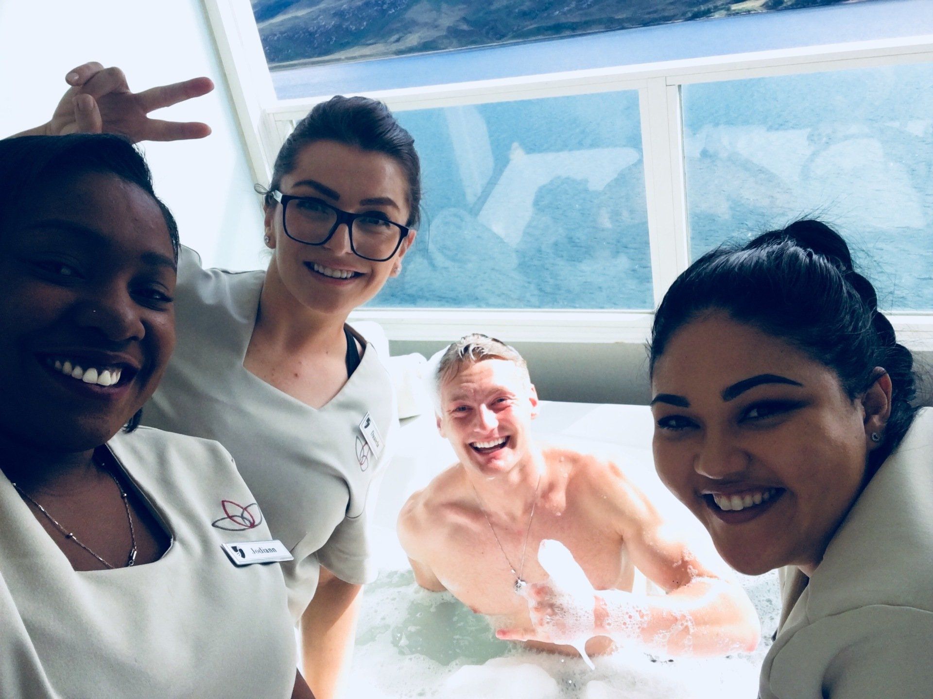 Xander Clemens on the Seabourn Questin the jacuzzi with Daniela Dume, Michelle Samuels, and Jodi Gooddaz Fi Dem.