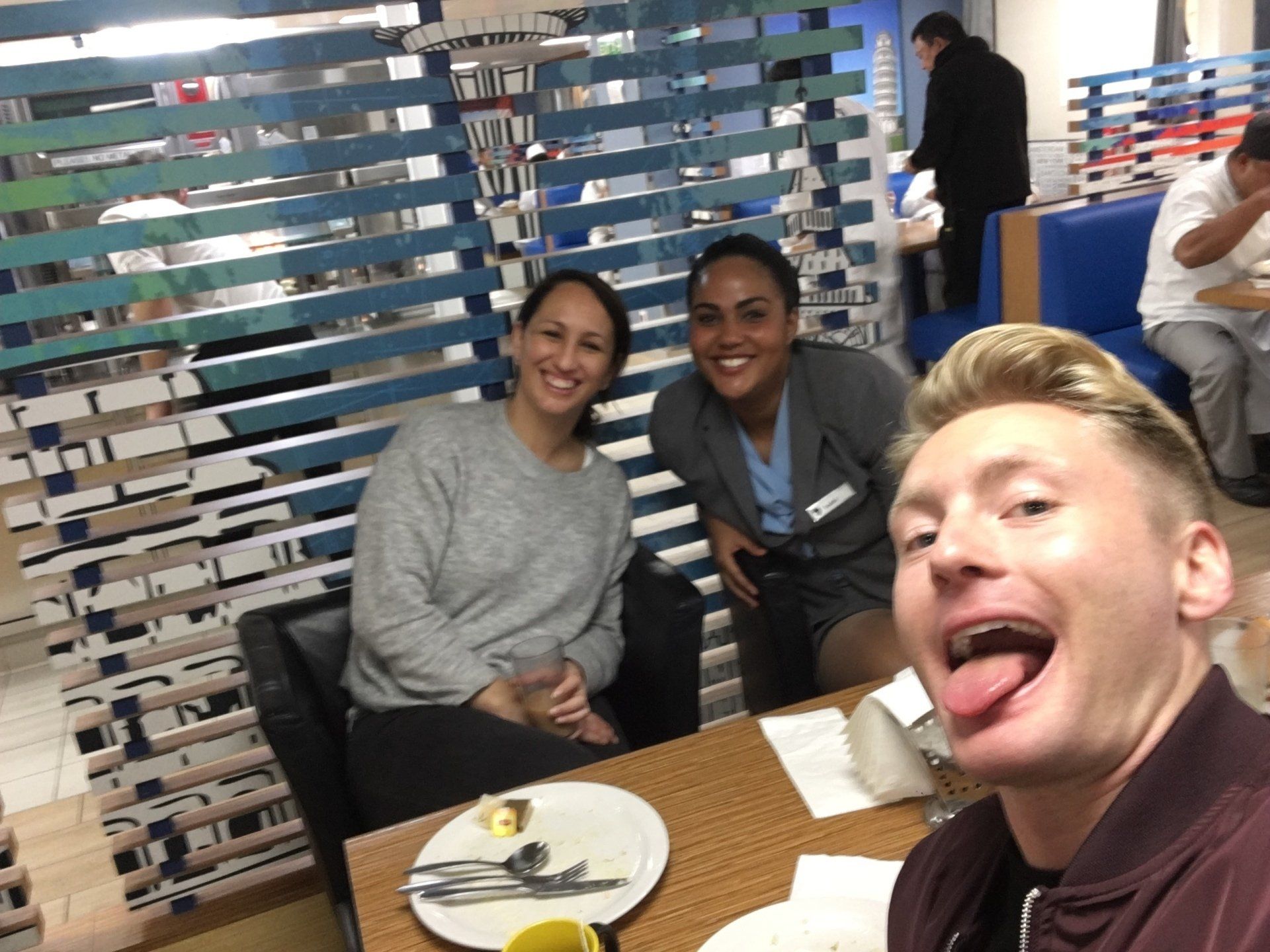 Xander Clemens in the crew mess of the Seabourn Quest with crew members.