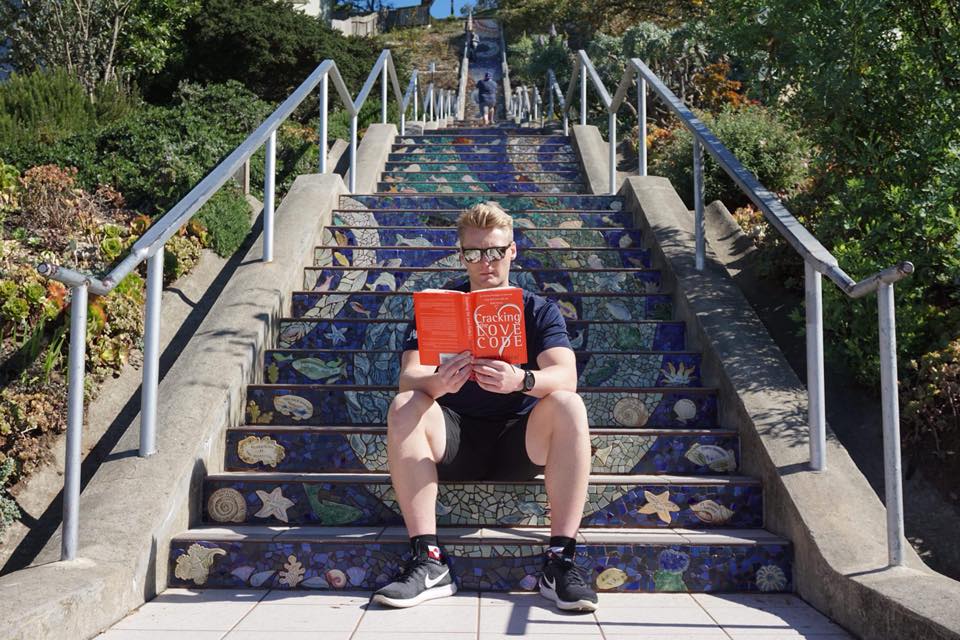 Xander Clemens is in San Fransisco at 16th Avenue Tiled Steps reading the book Cracking the Love Code by Janet O’Neal