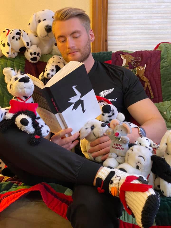 Xander Clemens reading the book Black Swan by Nassim Nicholas Taleb