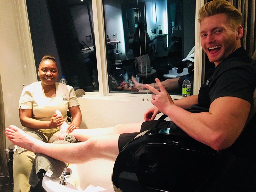 Xander Clemens receiving a pedicure from Jodi Gooddaz Fi Dem