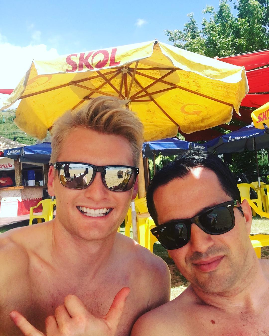 Xander Clemens with Emil Kotrri in the beach of Ilhabela, Brazil.