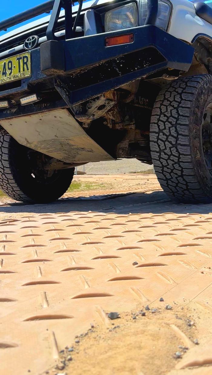 image of sand coloured track mats, with MKP molded down one side