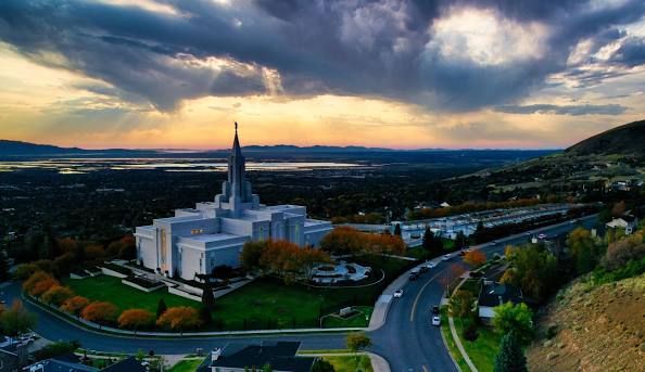 An aerial view of a residential neighborhood with mountains in the background.